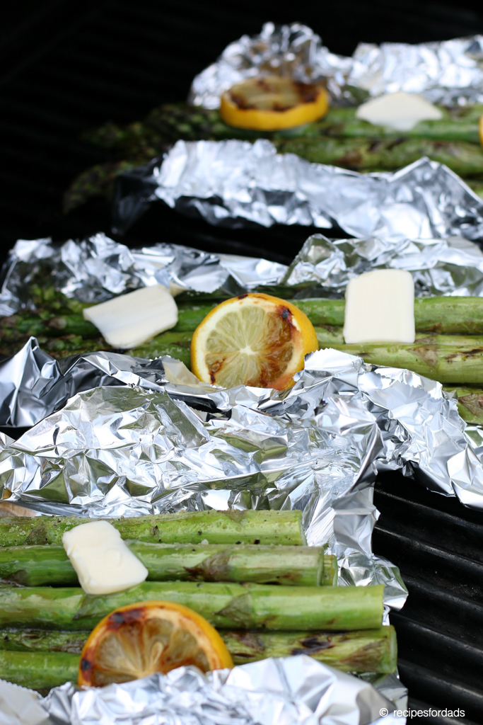 grilled asparagus in foil, topped with butter and lemon