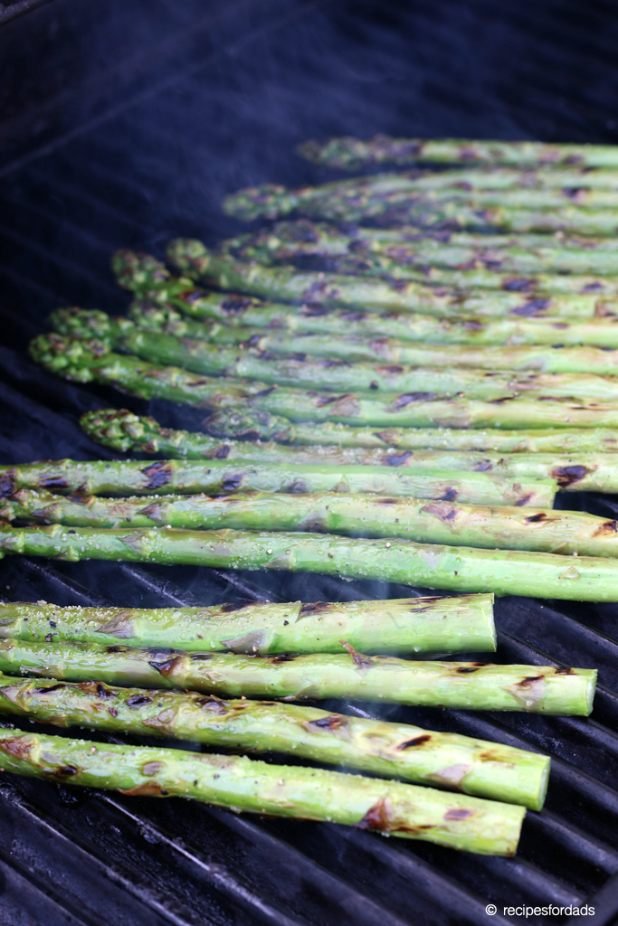 Asparagus cooking over the grill