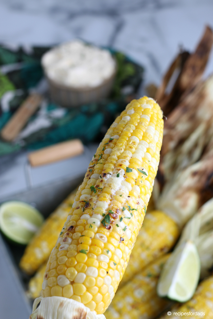 Corn seasoned with butter and parmesan cheese