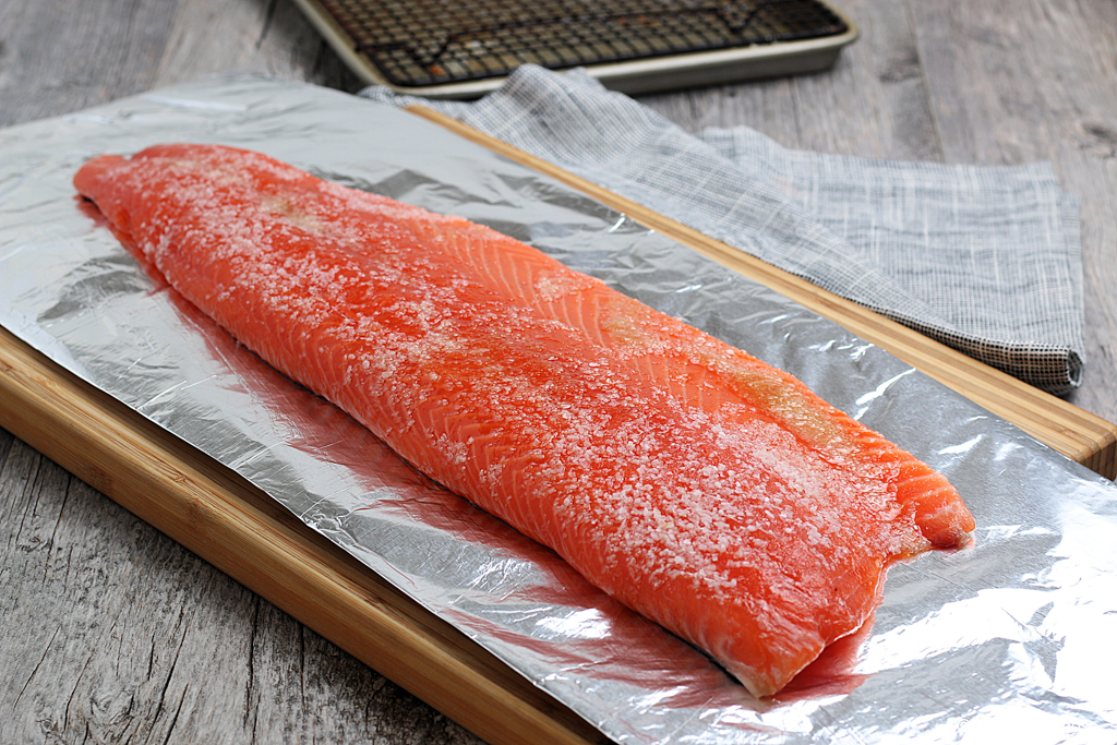 Kosher salt sprinkled on top of wild salmon