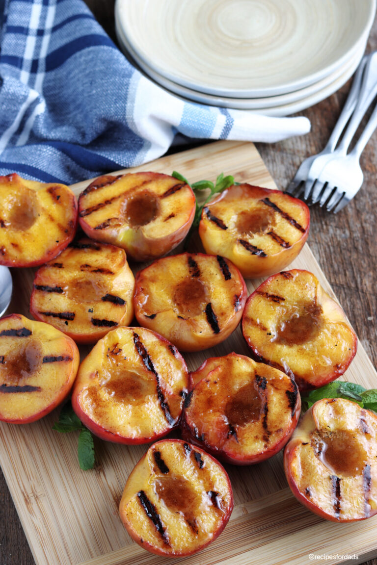 grilled peaches served with blue napkin