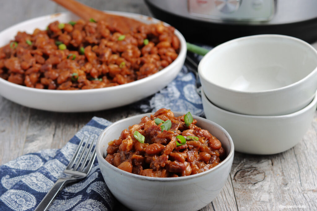 bbq beans served in white bowl with instant pot
