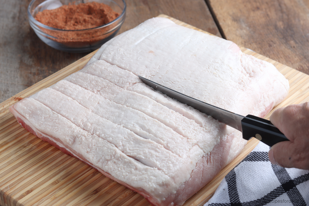 Scored Pork Belly with filet knife