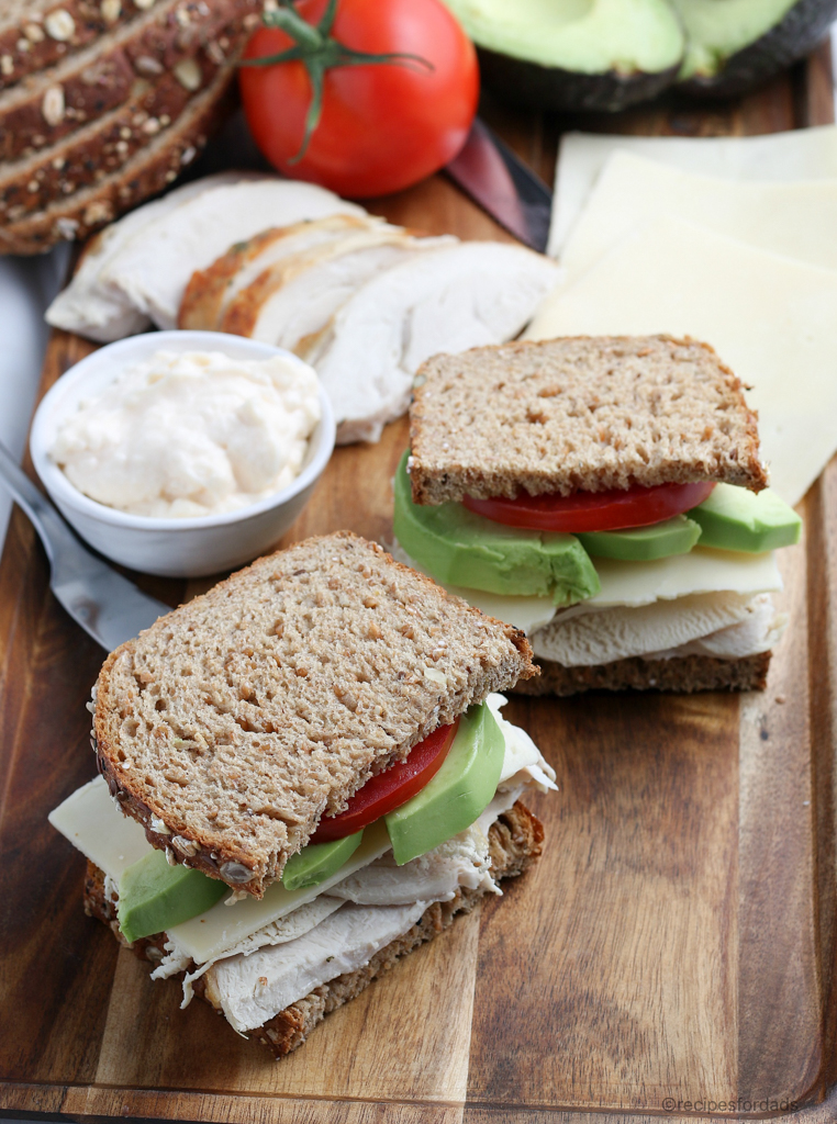 Turkey Sandwich served with avocado, mayonnaise, cranberry sauce and tomato