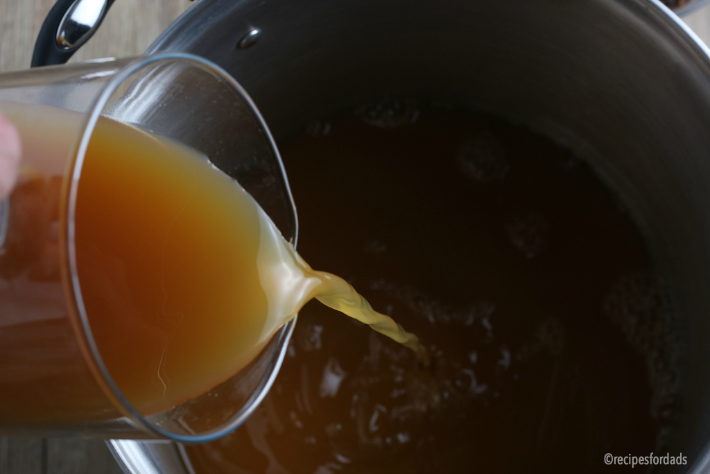Pork Shoulder Brine pouring apple cider vinegar