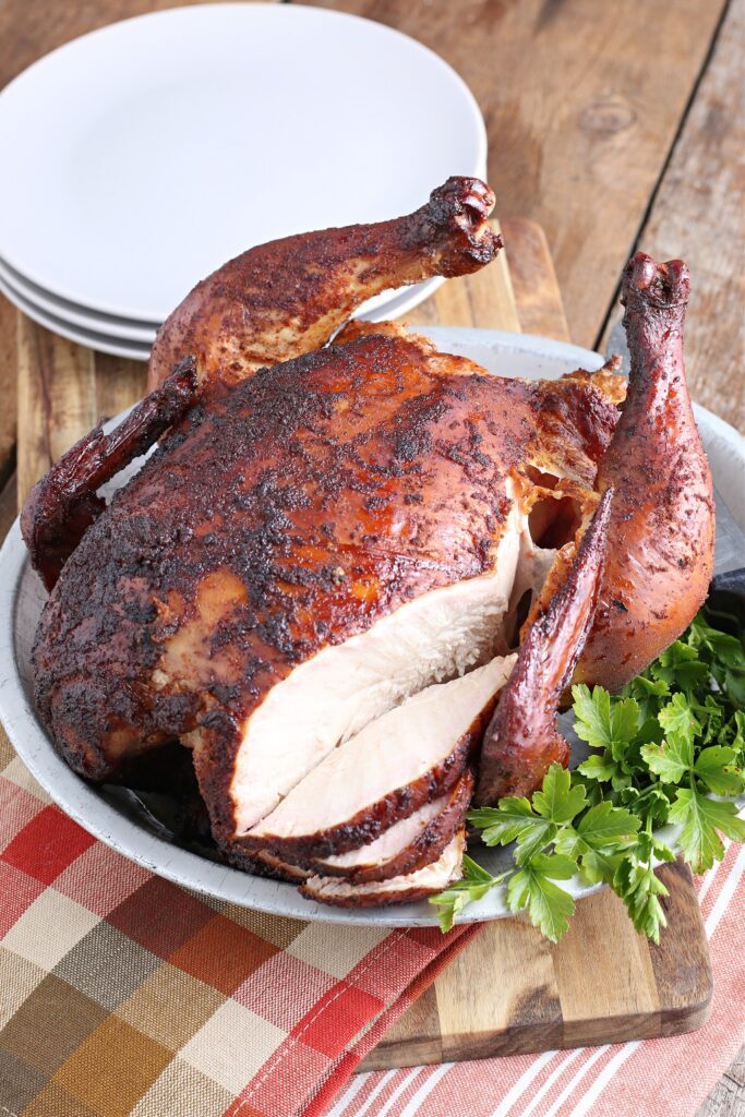 Smoked Beer Can Chicken served with orange and brown checkered napkin