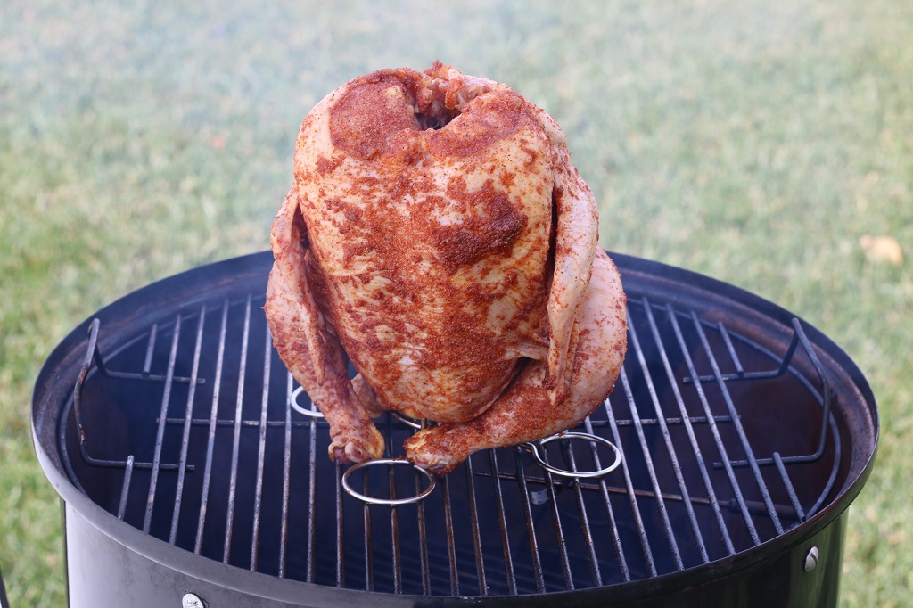 Chicken on beer stand in Weber smoker