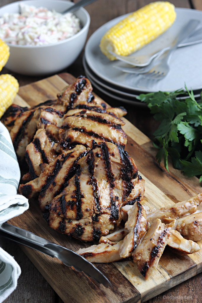 Grilled Boneless Chicken Thighs served on cutting board