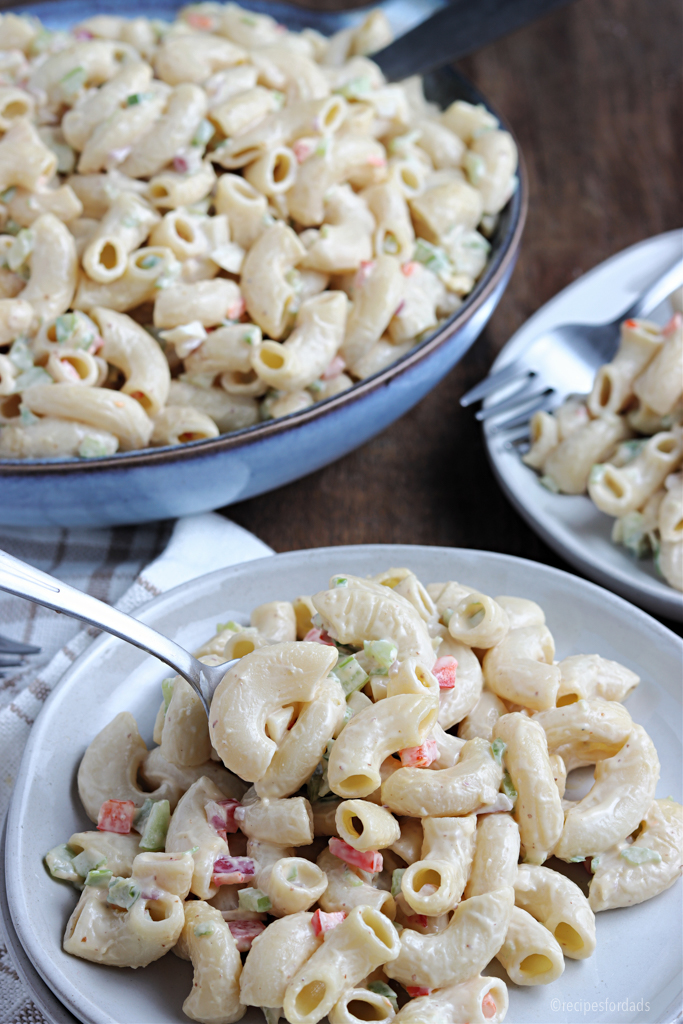 macaroni salad served on white dish