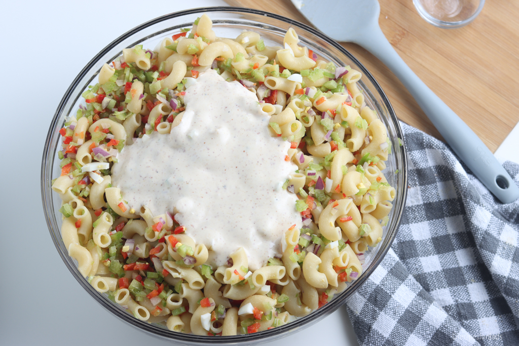 Pour dressing over macaroni salad