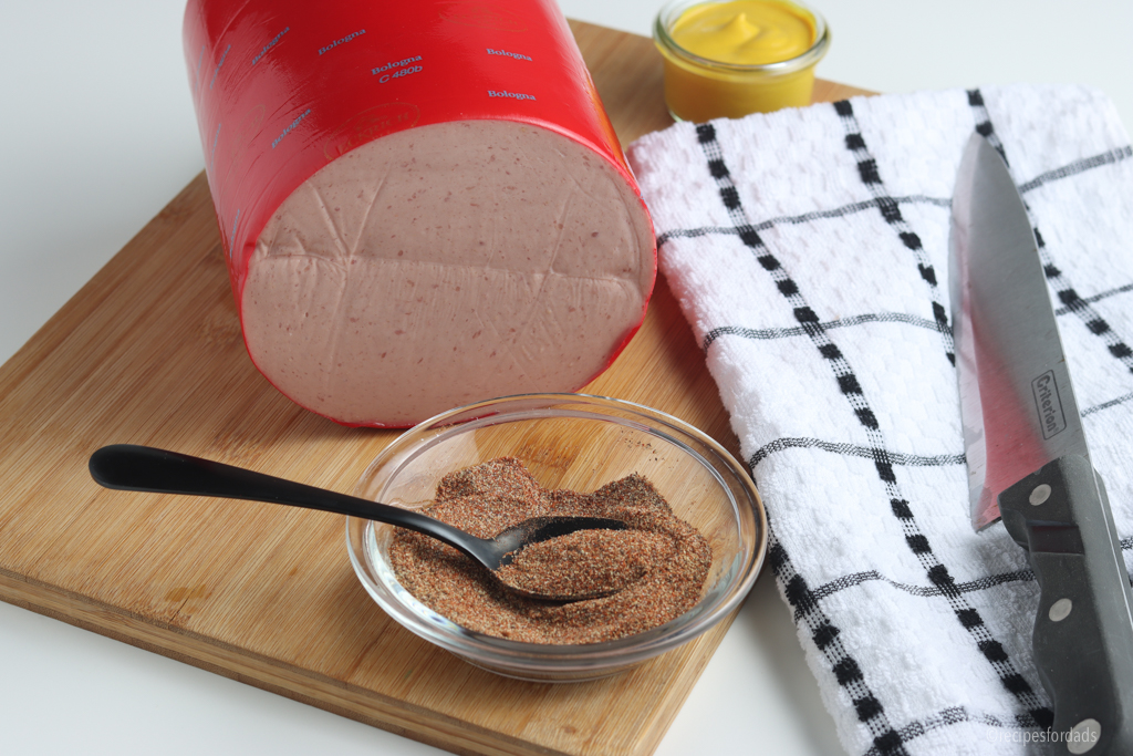 bologna on cutting board with Spices (Rubs) 