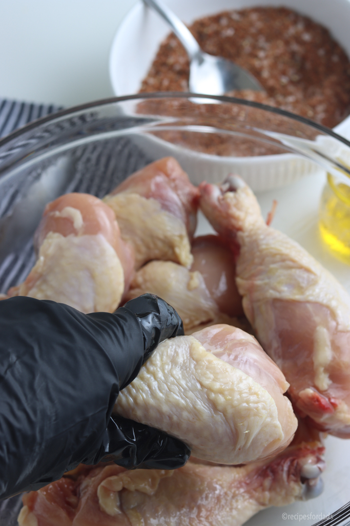 Chicken drumsticks in bowl.
