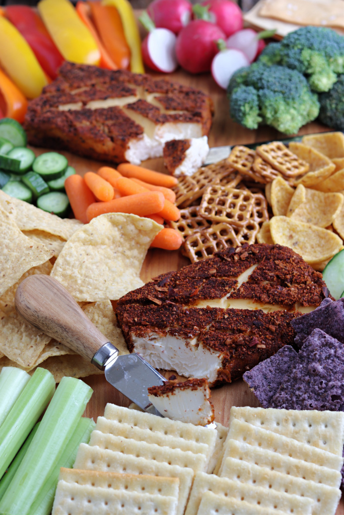 charcuterie board with vegetables and chips