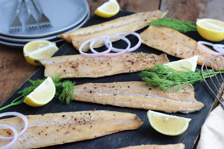 smoked rainbow trout with onions, lemons and dill