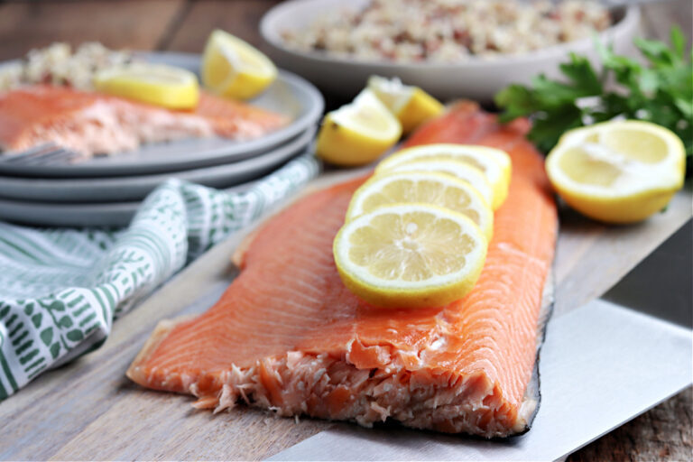 smoked salmon served on gray plate with lemon