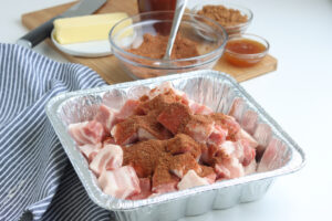 pork belly ends in aluminium pan with spices