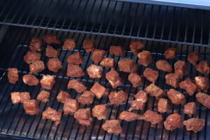 pork belly cubes on Traeger smoker