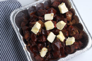 pork belly ends in aluminium pan with brown sugar and butter