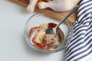 spices in clear glass bowl for smoked chicken quarters