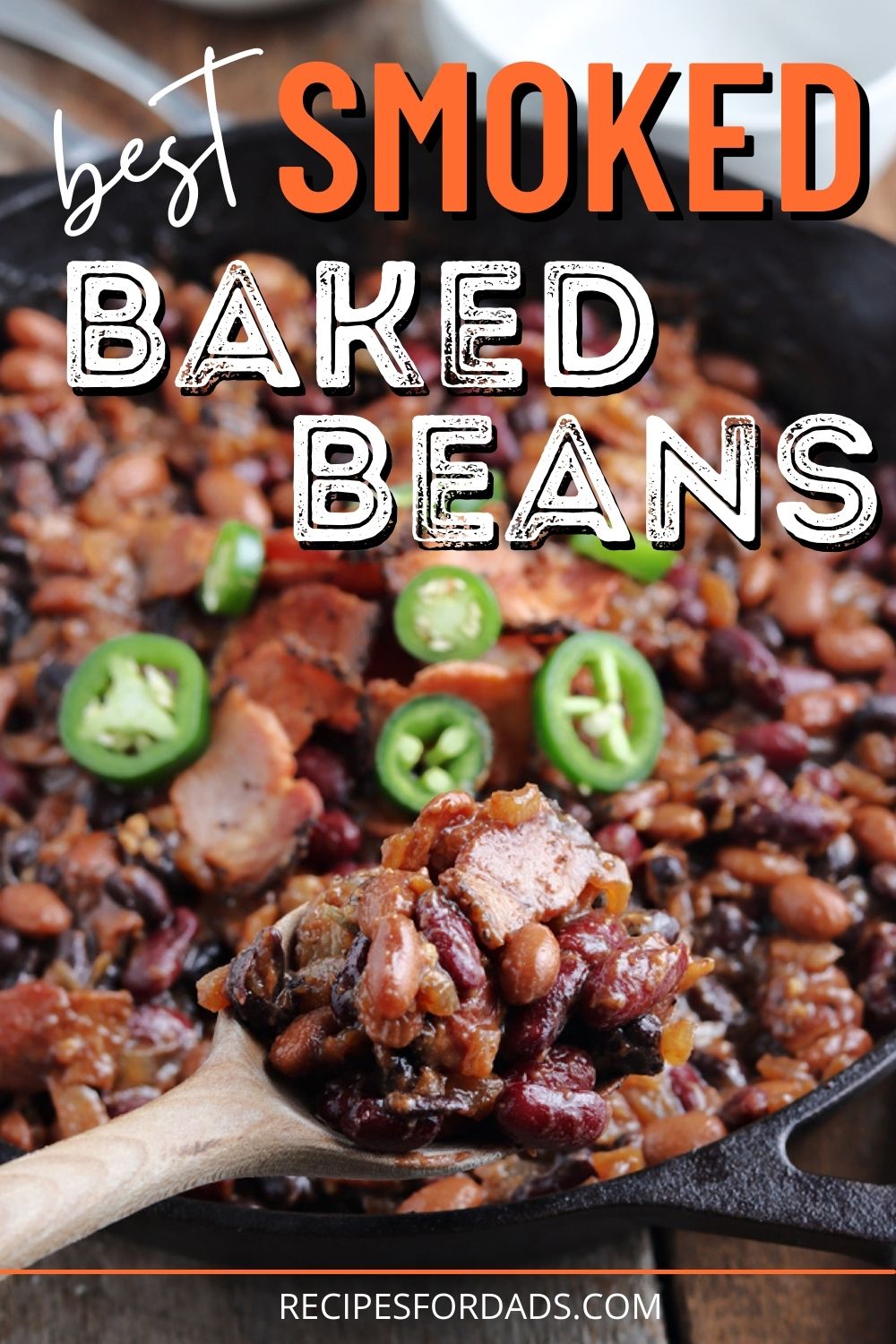 smoked baked beans in iron skillet pin graphic for pinterest