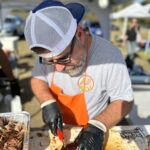 mark rogers cutting brisket at georgia bbq competition